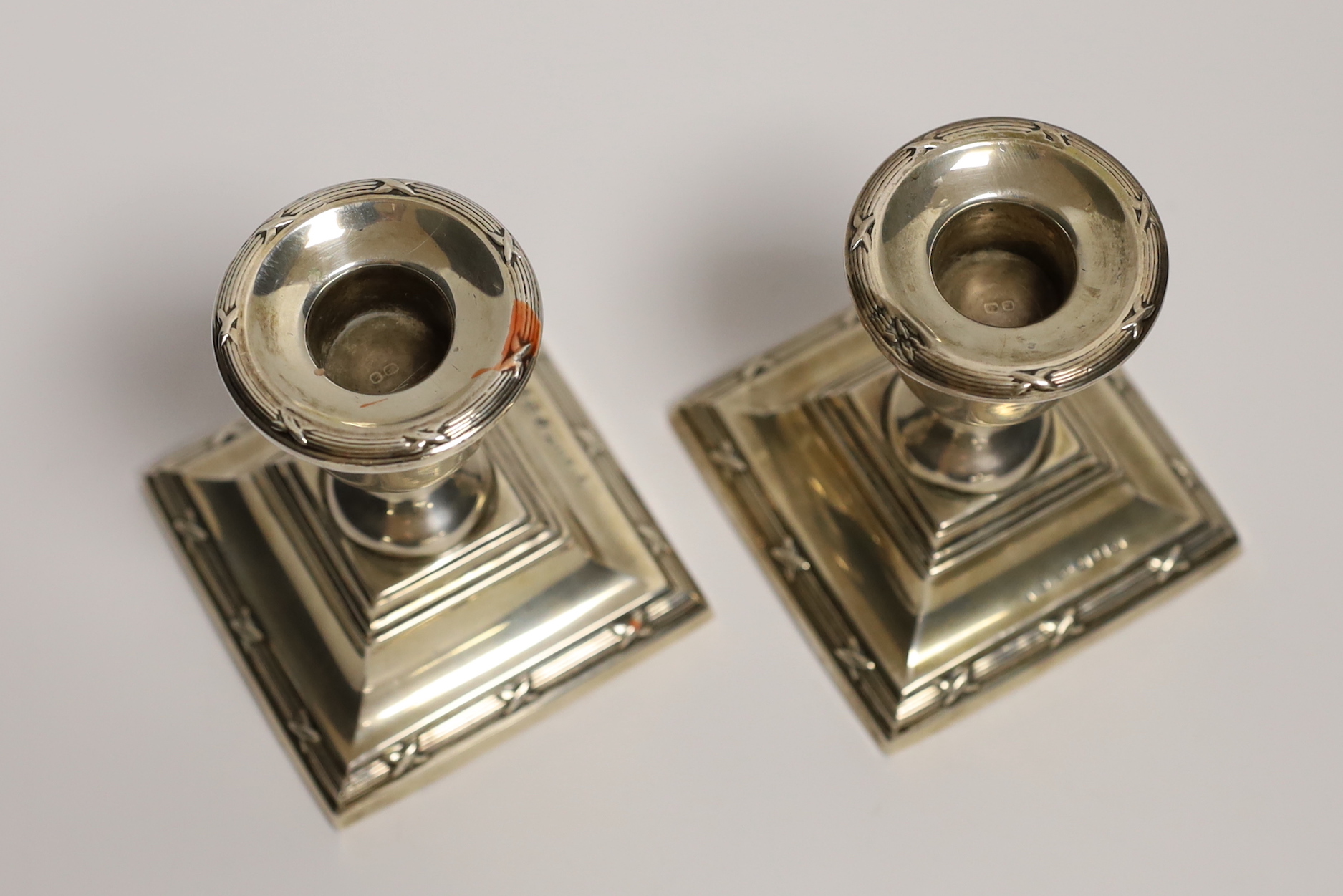 A pair of George V silver mounted dwarf candlesticks, S. Blanckensee & Sons Ltd, Birmingham, 1923, 85mm, weighted.